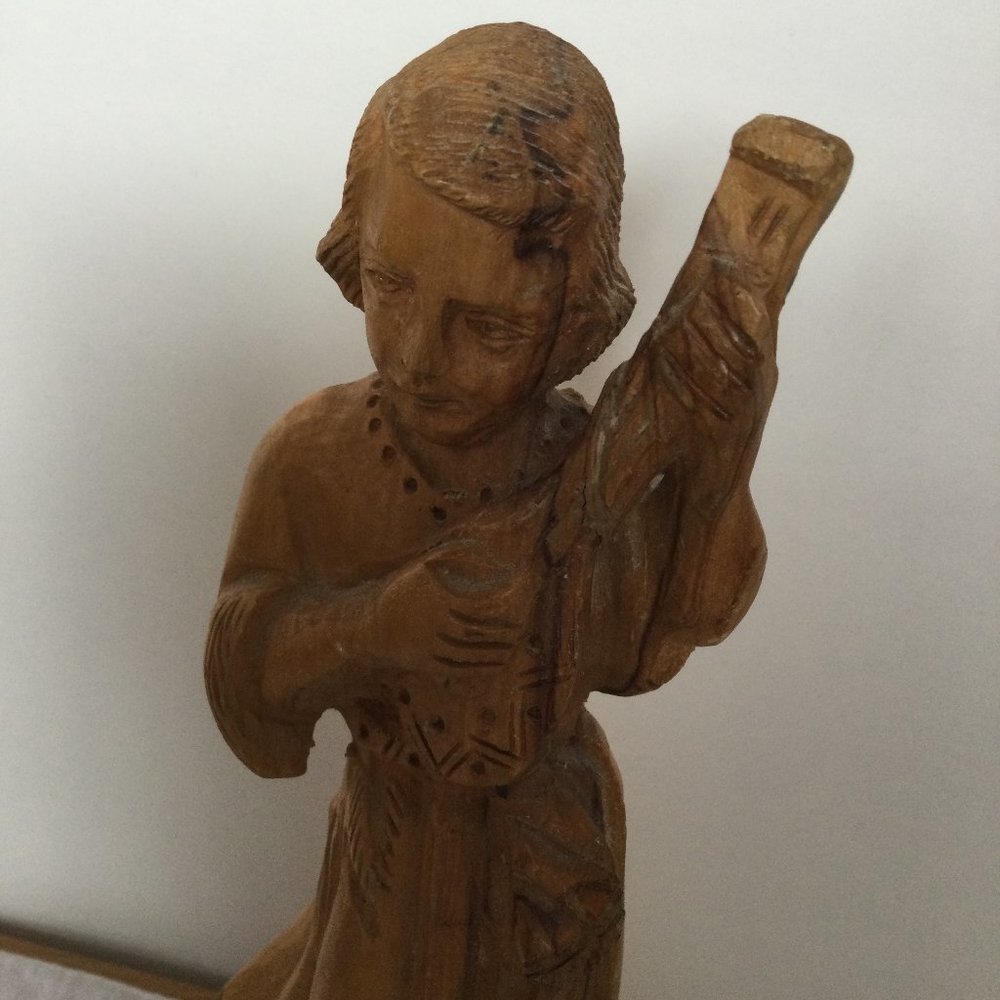 vintage carved wood figurine lady playing music